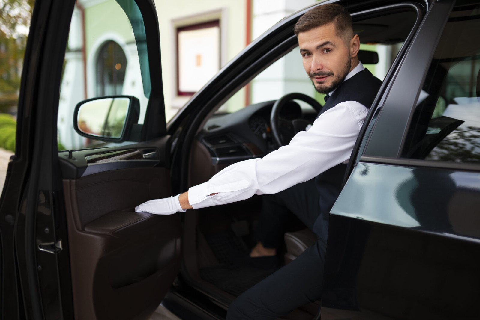 a man sitting in a black car service crestwood