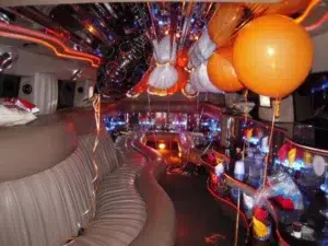 Guests celebrating a birthday inside a VIP party limousine